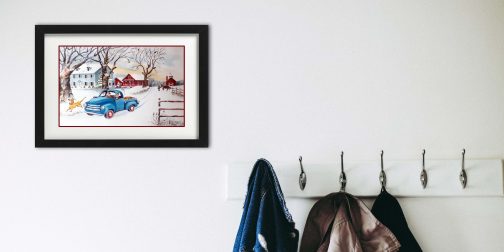 Road wall art framed by coat rack